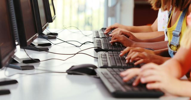 Schoolgirls using computer in classroom at school - Download Free Stock Photos Pikwizard.com