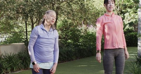 Asian Mother and Daughter Outdoor Exercise Surrounded by Nature