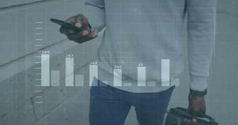 Business Professional Analyzing Graphs on Smartphone