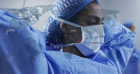 Adjusting surgical gown and mask preparing for global response with world map overlay