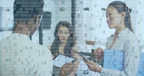 Medical Team Analyzing Data with Technology and Binary Overlay