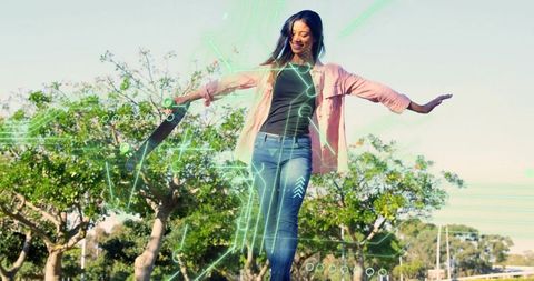 Balancing female skater holding skateboard with neon augmented reality HUD overlay