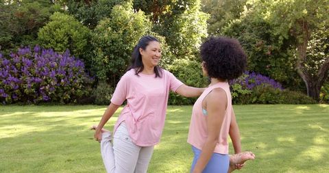 Mother and Daughter Bonding Through Outdoor Stretching