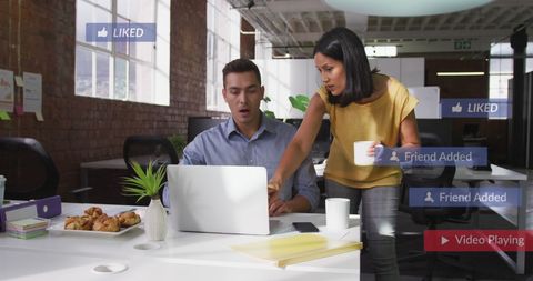 diverse coworkers analyzing reports with social media notifications - Download Free Stock Images Pikwizard.com