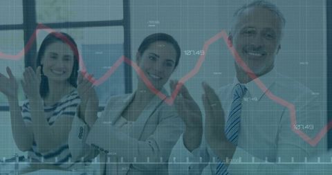 Business Team Celebrating Success with Positive Financial Trends