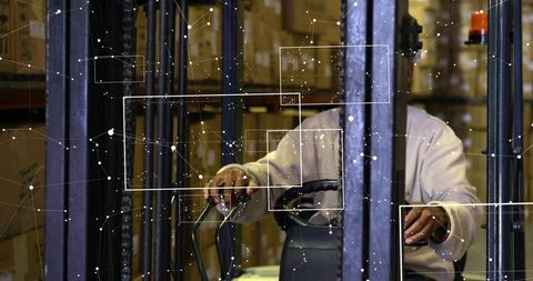 Operating forklift driver navigating warehouse racking aisle with digital HUD overlay