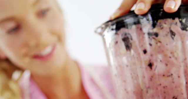 Woman Blending Fresh Berry Smoothie in Blender - Download Free Stock Images Pikwizard.com