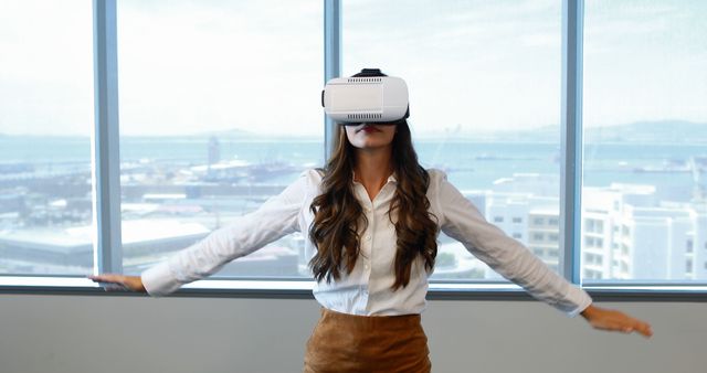 Woman Experiencing Virtual Reality in Office with Ocean View - Download Free Stock Images Pikwizard.com