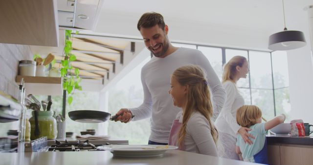 Happy Family Cooking Pancakes for Breakfast in Kitchen, Caucasian Family Bonding - Download Free Stock Images Pikwizard.com