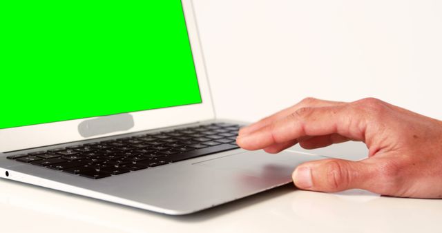 Person using Macbook with green screen for presentation - Download Free Stock Images Pikwizard.com