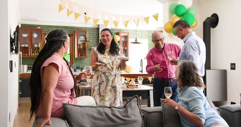 Senior Woman Celebrating Birthday with Friends in Home Setting