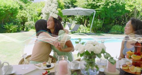 Sunlit Poolside Brunch Friends Hugging in Garden, Joyful Floral Crown, Pastries and Tea