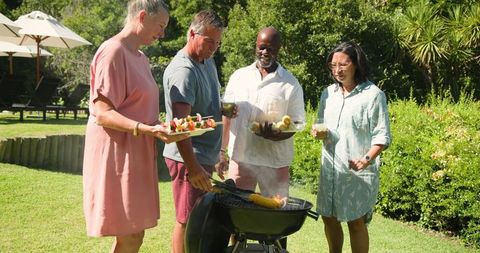 Diverse Group Enjoying Backyard Barbecue Together