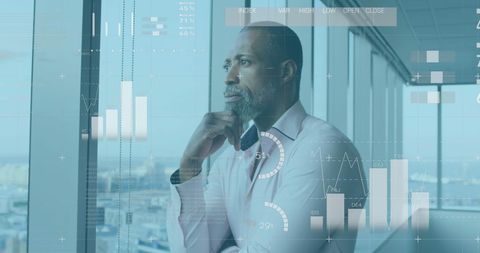 Pensive Businessman Analyzing Financial Trends in Modern Office - Download Free Stock Images Pikwizard.com