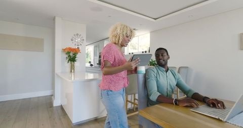 Couple Enjoying Technology at Home