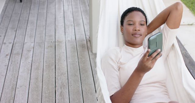 Relaxing Woman Using Smartphone in Hammock Outdoors - Download Free Stock Images Pikwizard.com