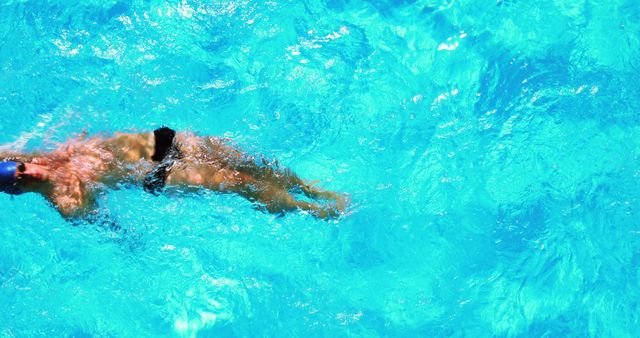 Male Swimmer in Vibrant Blue Water of Swimming Pool - Download Free Stock Images Pikwizard.com