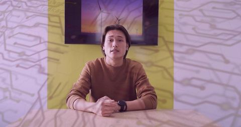 Focused man discussing sustainability in modern workspace