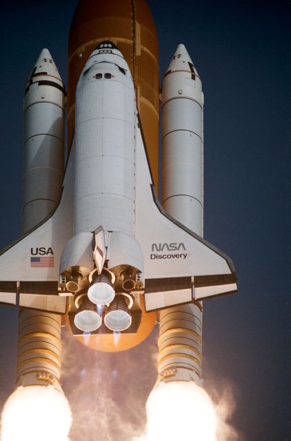 Space Shuttle Discovery lifting off on STS 51-G mission from Kennedy Space Center on June 17, 1985. Image captures rocket boosters and external tank during liftoff with diamond shock effect. Ideal for use in educational materials, space exploration exhibits, and aerospace history publications.