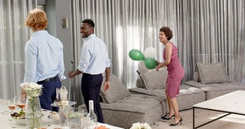 Friends Cleaning Up After Joyous Wedding Celebration