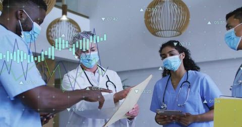 Healthcare Team Discussing Patient Data in Medical Office