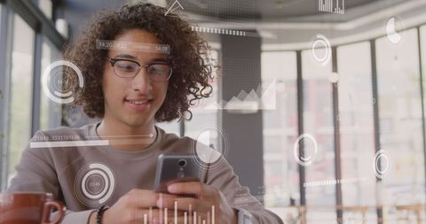 Smiling Young Man Interacting with Futuristic Smartphone Interface