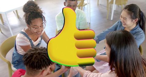 Students joining hands in teamwork circle with oversized yellow thumbs-up icon signaling unity