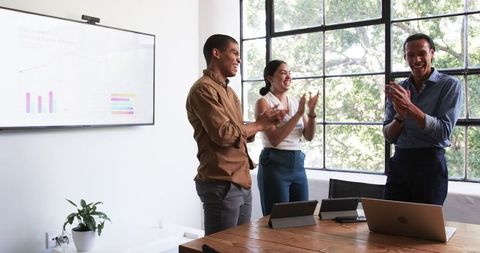Diverse Colleagues Celebrating Successful Business Meeting
