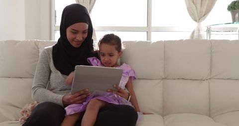 Mother and Daughter Sharing Digital Learning at Home