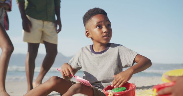 Little Boy Playing with Toys on the Beach - Download Free Stock Images Pikwizard.com