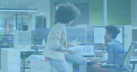 Innovative women collaborating in open-plan office environment