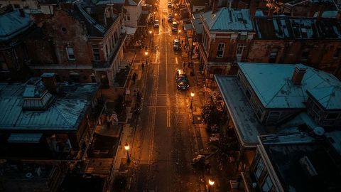 Moody louisiana urban night street with reflections and cars in motion
