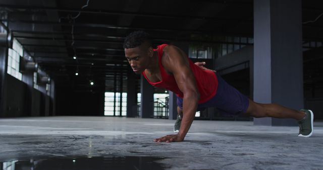 Athletic man doing one-handed push-ups in urban gym - Download Free Stock Images Pikwizard.com