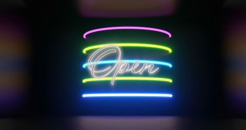 Neon 'Open' Sign with Colorful Lights on Black Background
