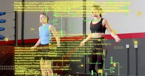 Two women jumping ropes in gym near boxing ring with futuristic hud overlay for cardio motion