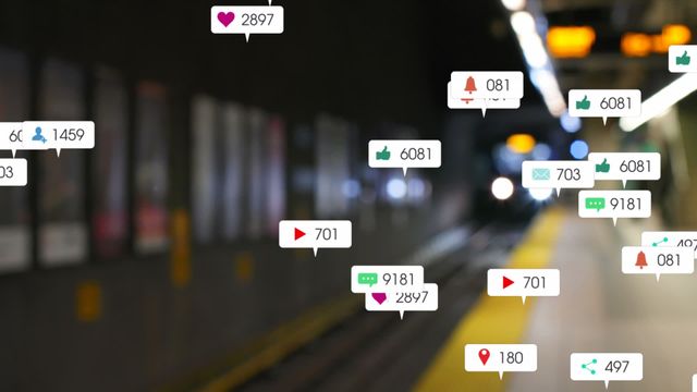 Digital animation shows social media engagement icons like likes, notifications, and followers over an out-of-focus train platform background. Ideal for use in projects relating to social media marketing, online engagement, transportation, and modern digital interactions.