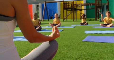 Yoga Session with Diverse Children in Outdoor School Playground