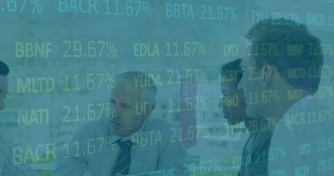 Business Team Analyzing Financial Data Over Digital Display