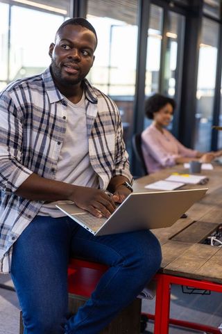 African american professionals collaborating in modern office setting