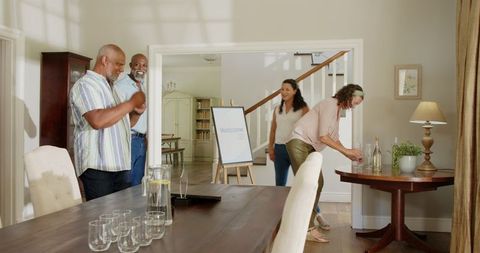 Senior Friends Bearing Items for Home Celebration Meeting