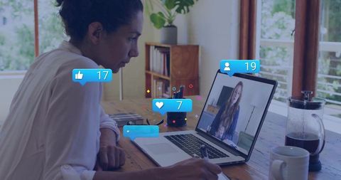 Woman engaged in remote meeting with interactive icons