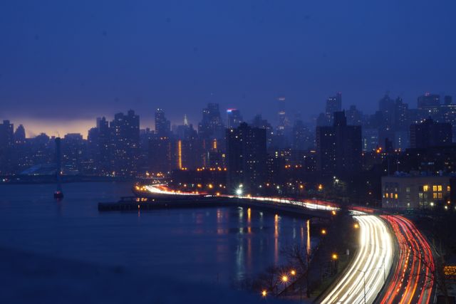 Nighttime Cityscape with Light Trails by the Water - Download Free Stock Images Pikwizard.com