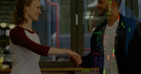 Two Professionals Shaking Hands with Digital Data Overlay