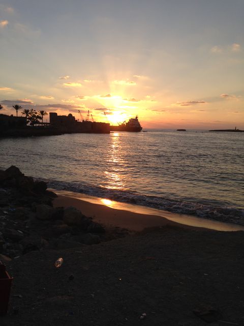 Idyllic Sunset Over Ocean Horizon with Silhouette Ship - Download Free Stock Photos Pikwizard.com