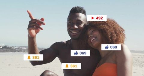 Couple Enjoying Beach Vacation with Social Media Icons Overlay