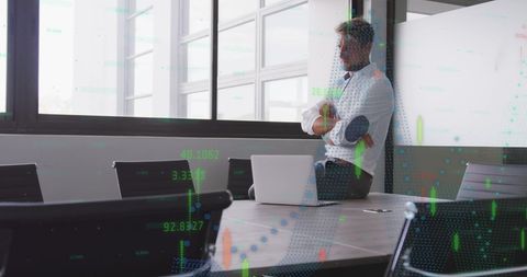 Businessman Contemplating Digital Business Growth Metrics in Modern Office