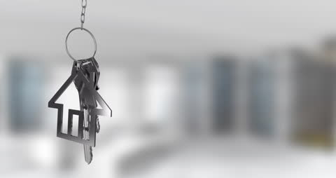 House-Shaped Keychain with Keys Symbolizing Home Ownership