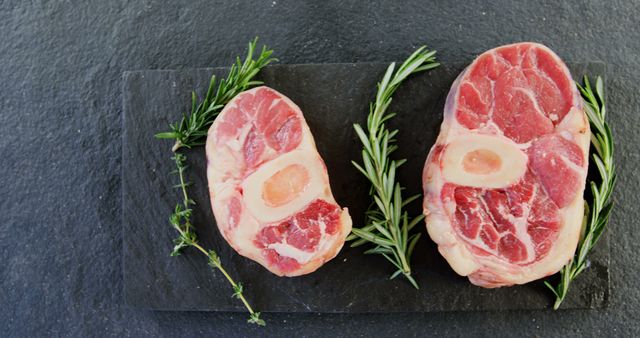 Raw Beef Shanks with Bone and Fresh Rosemary on Slate Board - Download Free Stock Images Pikwizard.com