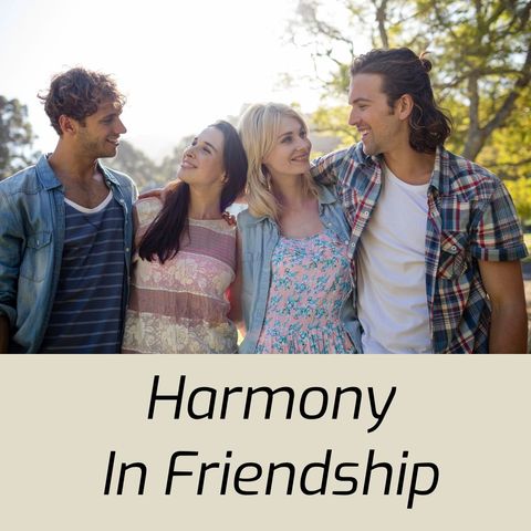 Smiling friends embracing in park on sunny day