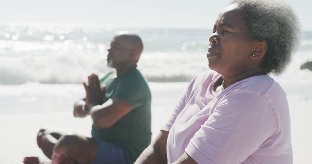 Senior African American Couple Meditating on Beach, Enjoying Peaceful Moment Together - Download Free Stock Images Pikwizard.com